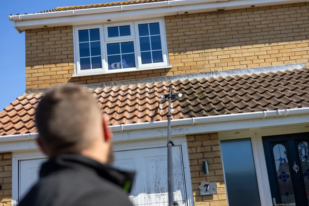 Cleaned windows and front door of a modern brick house after a Safe'N'Clean visit